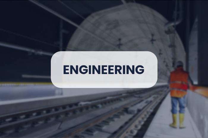 A subway tunnel with a technician on board, representing one of our business sectors, engineering.